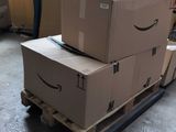 boxes stacked on top of each other on a pallet in a warehouse