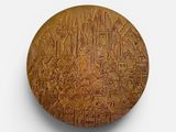 an image of a wooden plaque with a picture of a city on it