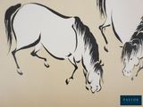 two horses that are standing next to each other on the wall