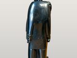 statue of a knight with a sword and shield on a pedestal