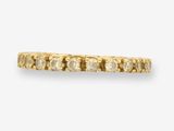 une bague en or jaune sertie de trois rangées de diamants