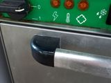 an image of a close up of a green and black oven