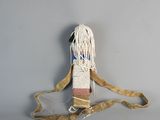an image of a white and brown bag with a rope