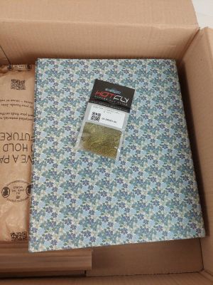 a box with a book inside of it on a table