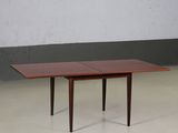 the table is made of wood and has a rectangular top