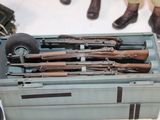 a toy truck with a bunch of guns in it