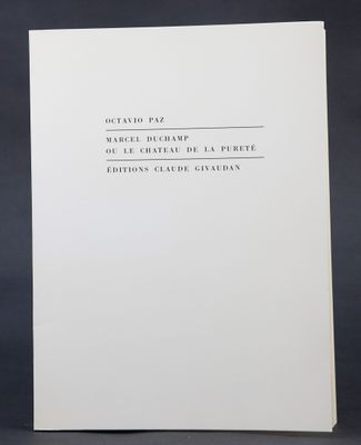 a white book with black writing on it sitting on top of a table