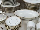 a lot of plates and cups on the table