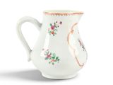 a white pitcher with a floral design on it