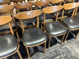 a lot of chairs that are lined up in a row