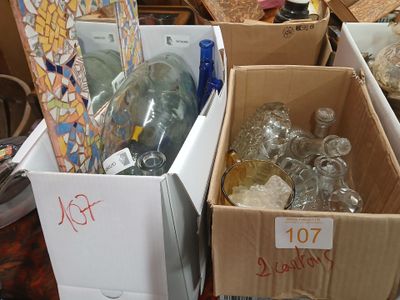 many boxes of empty glass bottles on a table