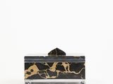 black and gold marble box with a black lid