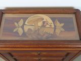 a wooden box with a picture of a man and a woman on it