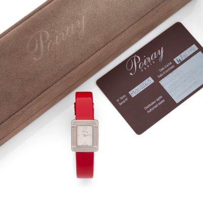an image of a watch and a credit card sitting on a table