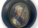 portrait d'un homme en uniforme militaire dans un cadre ovale bleu