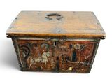 an old wooden box with a design on the front of it