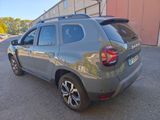 the rear end of a grey dacia parked in a parking lot