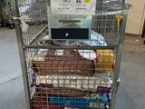 a metal cart with a lot of food in it