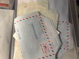 a open book with a bunch of mail inside of it
