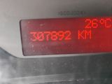 a digital clock on the dashboard of a car