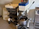 an image of a kitchen with a mixer and a table