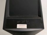 an image of a black computer monitor on a white table