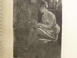 an open book with a black and white drawing of a woman sitting on a chair
