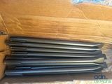 six pieces of drill bits in a cardboard box on top of a cardboard box
