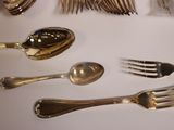 a table with a lot of silverware on it