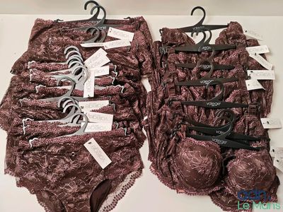 two bras and a pair of scissors on a table