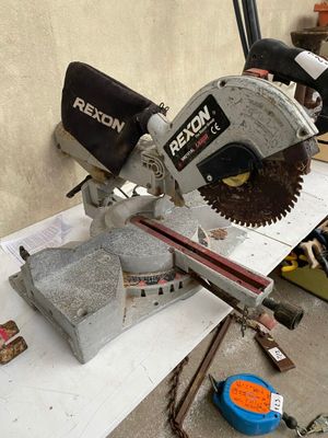 someone is using a circular saw to cut a piece of concrete