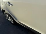 a close up of a car door with a dirty paint job