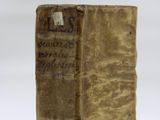 an old book sitting on top of a table next to a white background