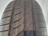 a close up of a tire on a white surface with a white background