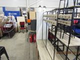 a room with a lot of shelves and chairs in it