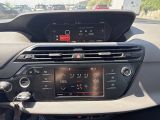 a dashboard of a car with a digital display on it