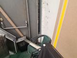 a black umbrella sitting on a chair in a room