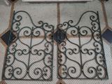 two iron gates on the floor in a room