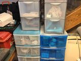 many plastic drawers stacked on top of each other in a room