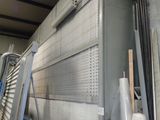 a large metal box sitting in the middle of a room