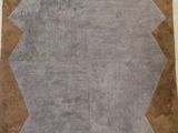 an image of a rug with a brown border on a white floor
