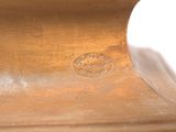 a brown vase that has a brown lid on it