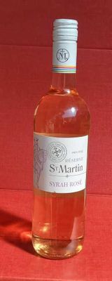 a bottle of wine that is sitting on a table