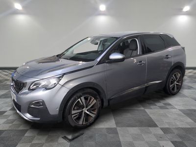 a silver suv parked in a room with a checkered floor
