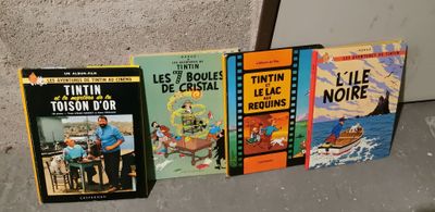 several books are lined up on a shelf in a room