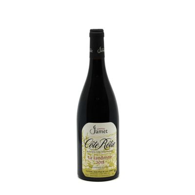 a bottle of wine sitting on top of a white table