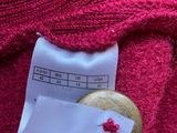 the label on the sweater shows the size of the sweater