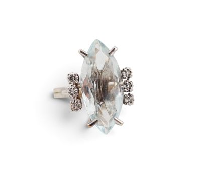 an image of a white topaz ring with diamonds on a white background