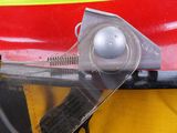 a close up of a fireman ' s helmet with a pair of scissors on it