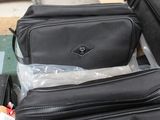 two pieces of luggage sitting next to each other on a table